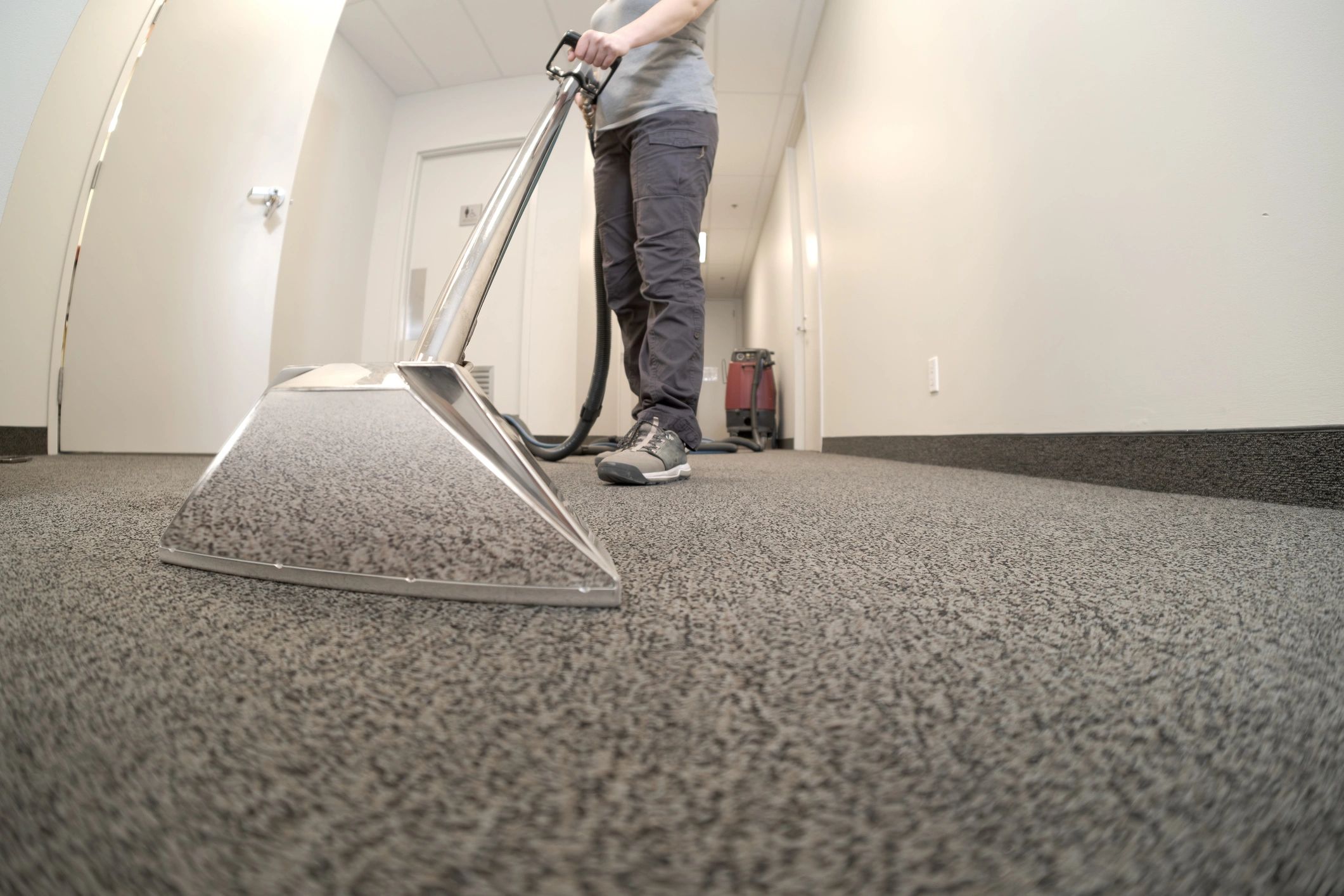 Close-up of professional carpet cleaning equipment in use