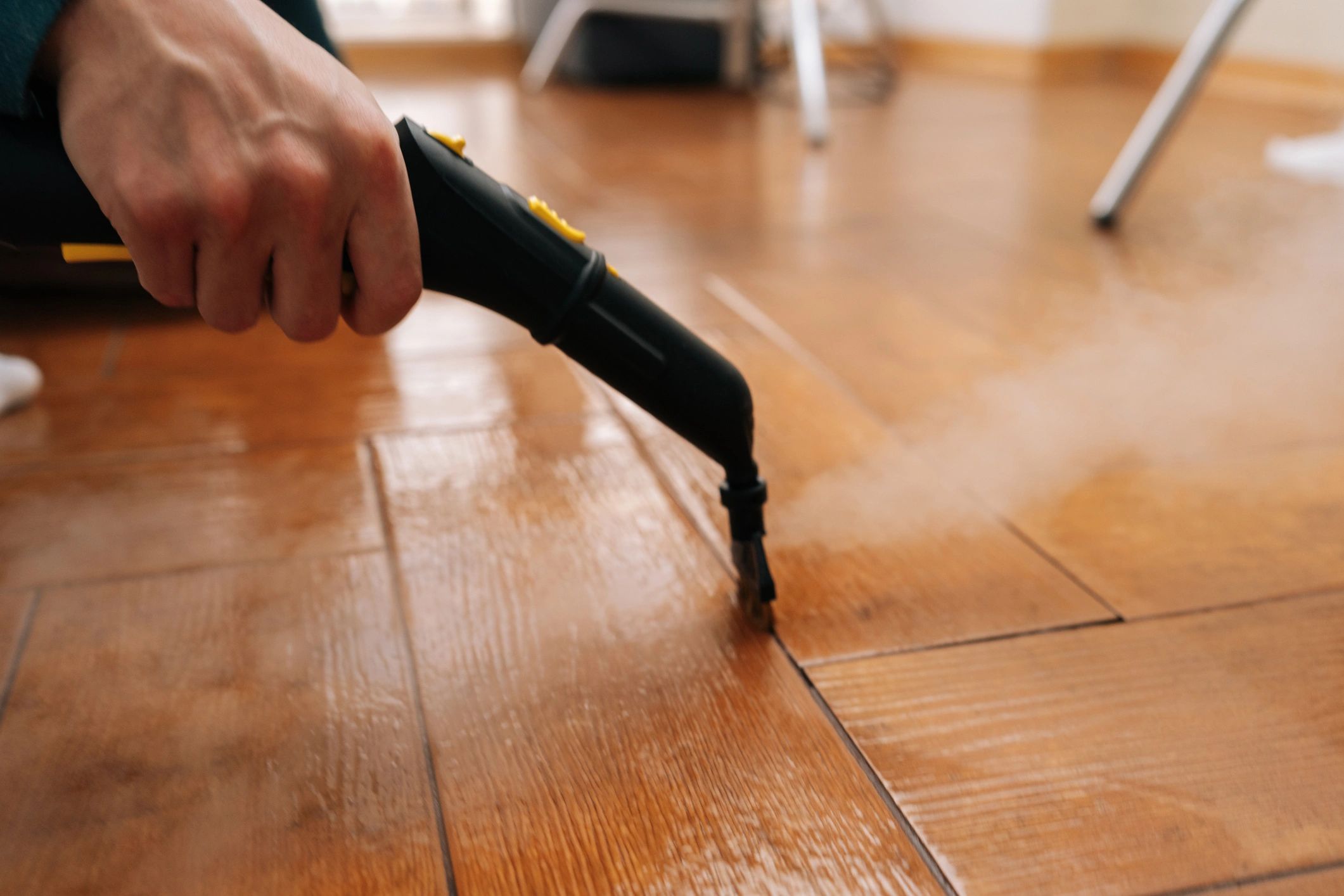Steam cleaning tile floor in a home
